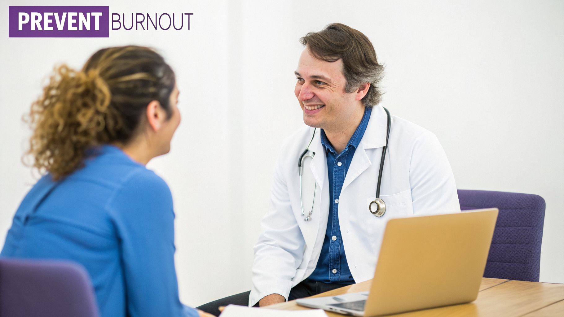 A smiling doctor in a white coat with a stethoscope talks to a patient during a consultation.