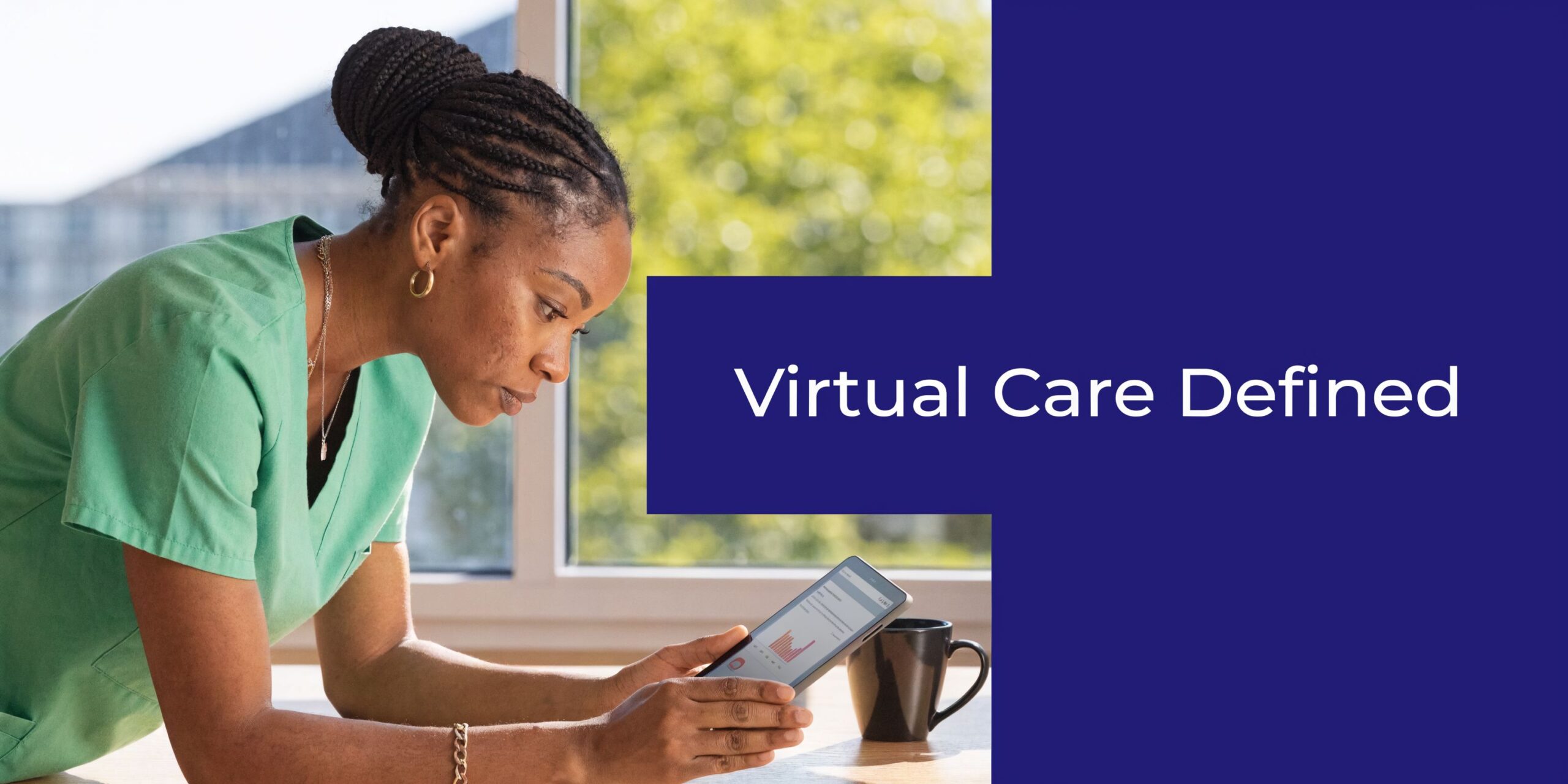 A healthcare professional in green scrubs examining health data on a tablet in a bright office.