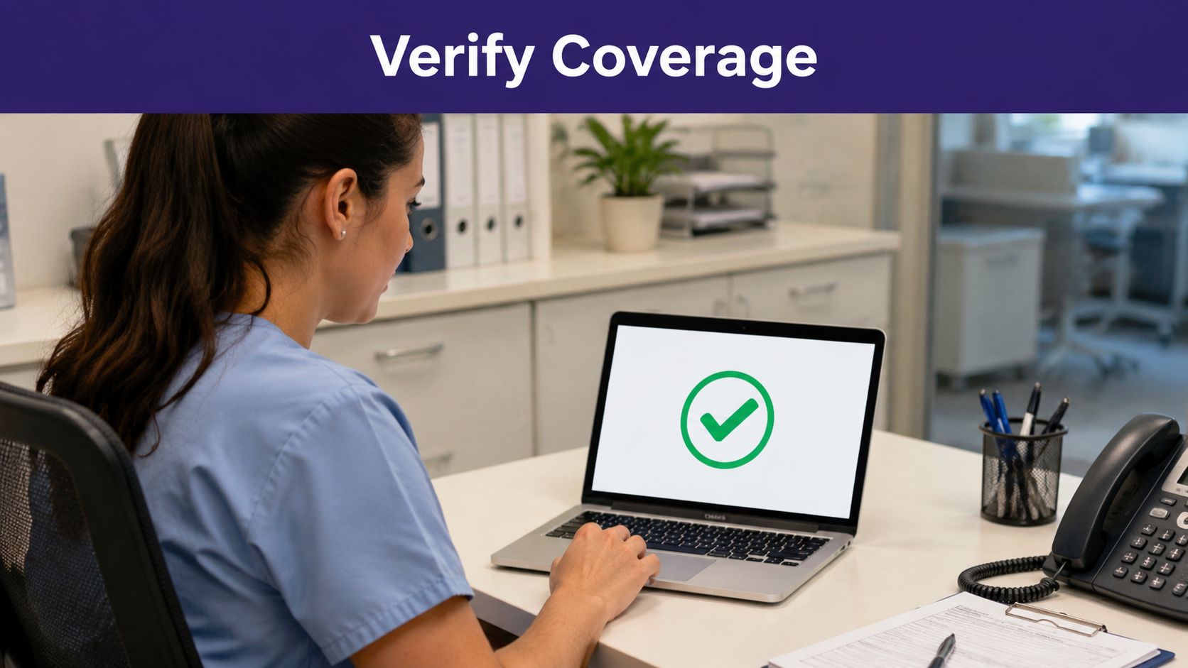 A healthcare professional in scrubs verifies insurance coverage on a laptop computer displaying a green checkmark.