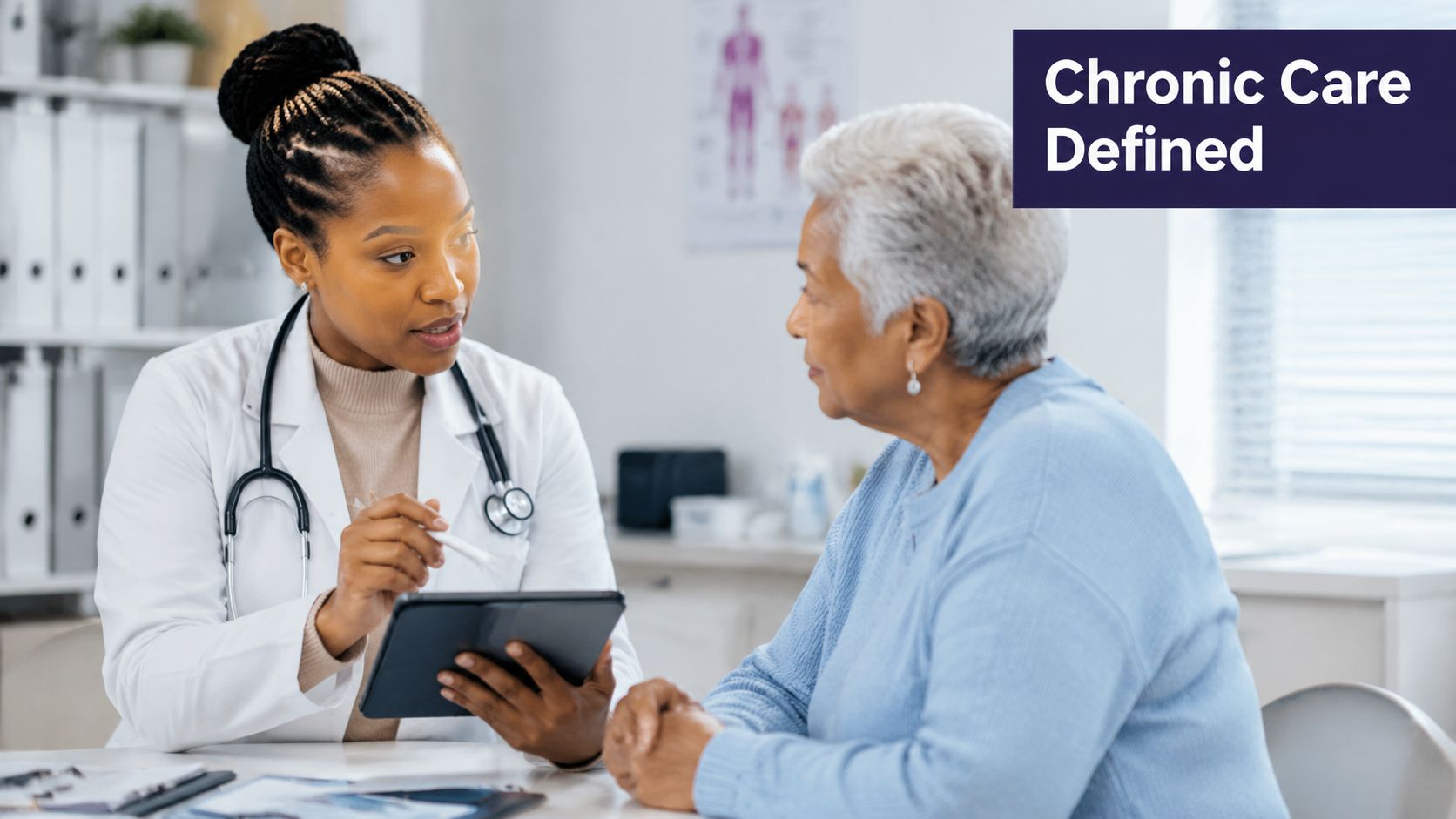 A female doctor with a stethoscope sits with an elderly patient and discusses information on a tablet.