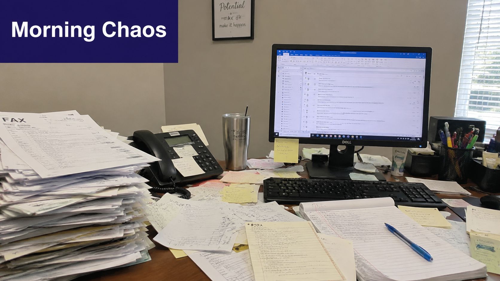 A cluttered office desk featuring a large stack of fax documents and a computer screen.