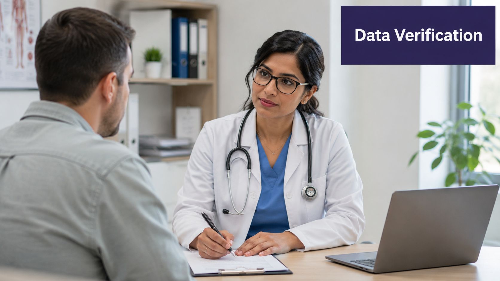 A female doctor with a stethoscope consults with a male patient while writing on medical forms.