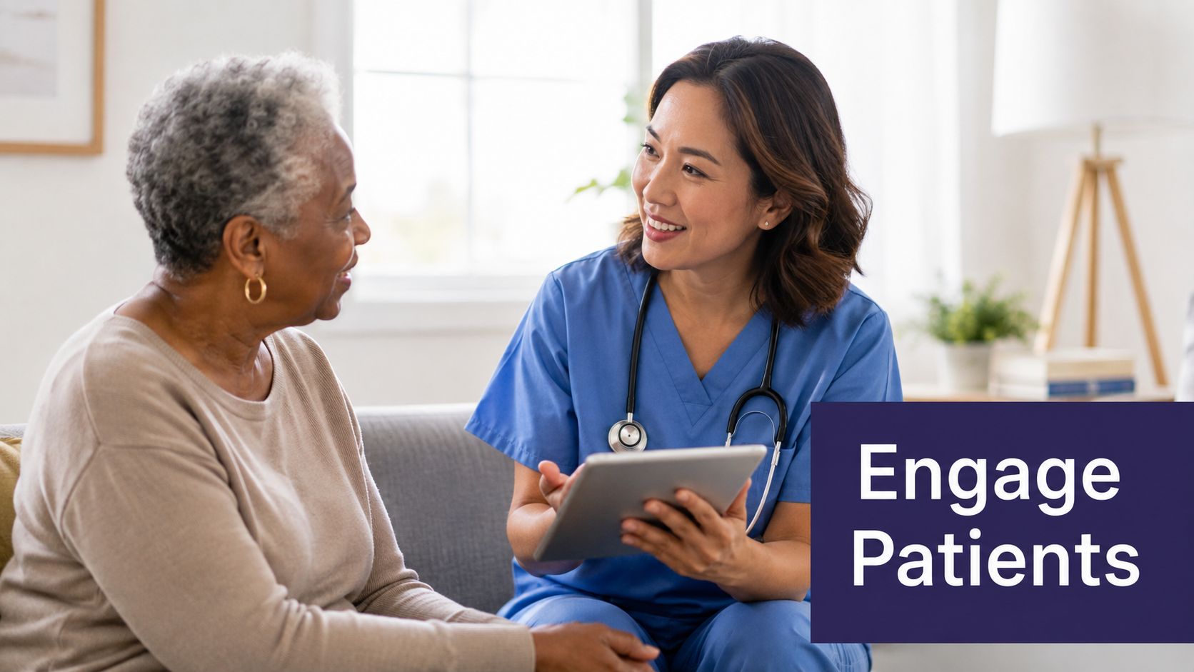 A friendly nurse smiling and discussing health information on a tablet with an elderly female patient.